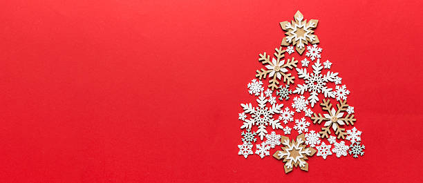 istock Christmas tree made from colored handmade ball decoration on colored background, view from above. New Year minimal concept with copy space 2248073729