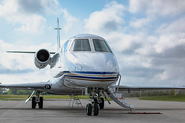 istock Front three-quarter view of a small corporate jet with boarding stairs lowered. 2248077999