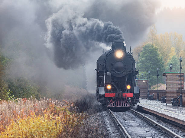istock Steam retro train arrives to the station platform. 2248080596