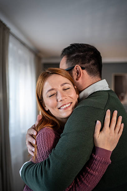 istock Loving couple embracing, sharing an affectionate moment at home 2248081919