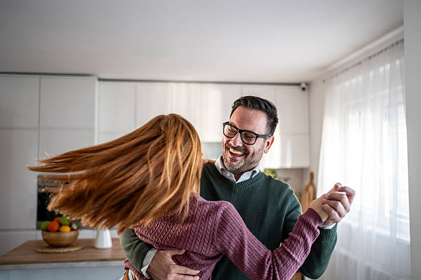 istock Happy couple dancing enjoying romantic moment in kitchen 2248081984