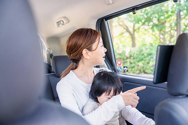 istock A mother looking out in a cab with her child 2248082153