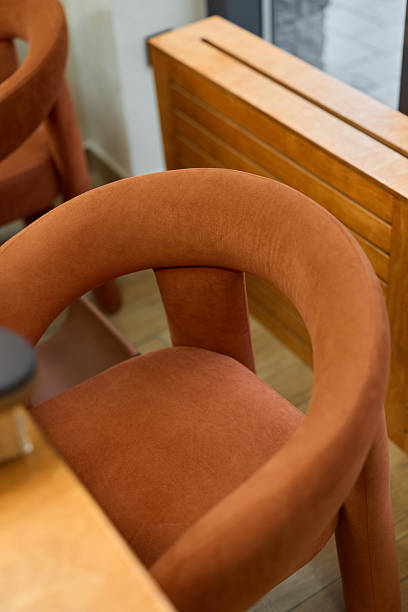 istock Comfortable curved seat with natural lighting and earthy tones 2248085242