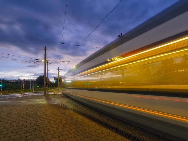 istock Tram stop. Public transport and sky during sunset. Blurred lights when the tram is moving. Transportation. Photo for postcards, wallpaper and backgrounds. 2248087140
