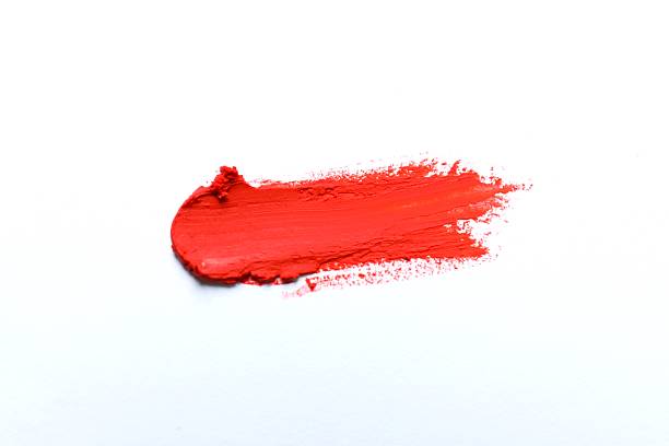 Smear of beautiful lipstick on white background, top view