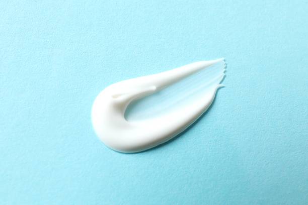 istock Smear of cream on a colored background 2248088157