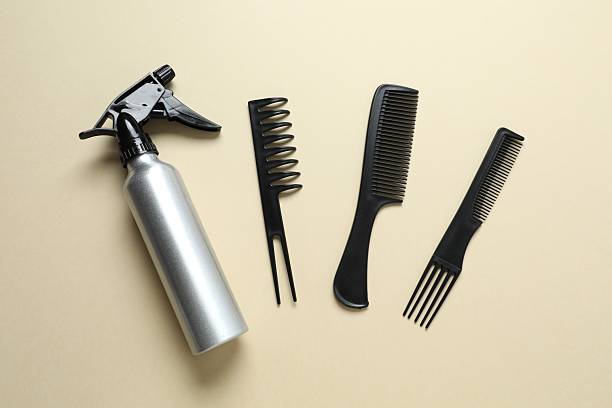 istock Professional combs and hairdresser tools on color background, top view 2248088277
