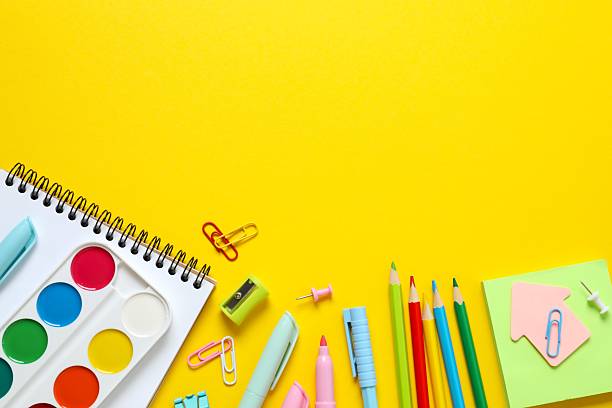 istock School stationery on yellow background, top view 2248088302