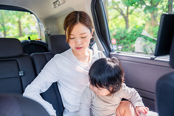 istock A mother with her child wearing a seatbelt in a cab 2248091330