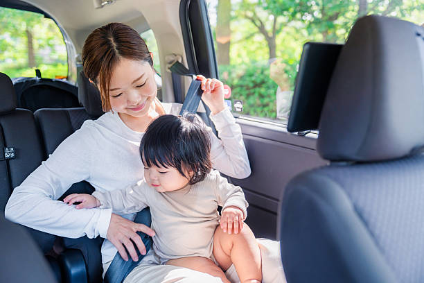 istock A mother with her child wearing a seatbelt in a cab 2248091351