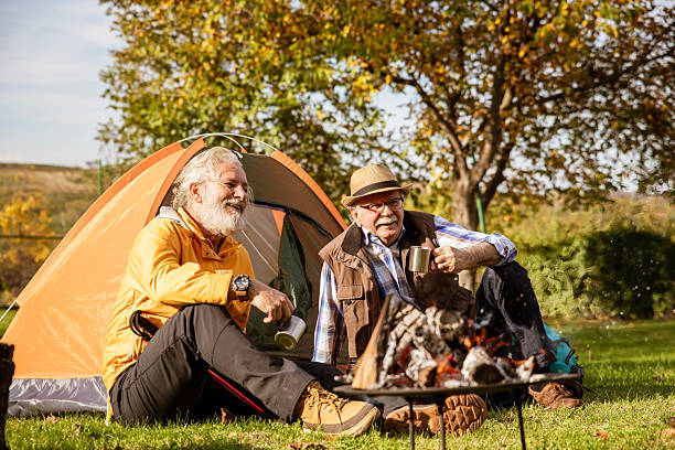 istock Happy senior man and his son bonding on camping 2248093513
