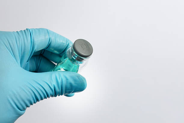 istock Scientist Holding Sample Vial with Rubber Septum for Laboratory Analysis 2248095450