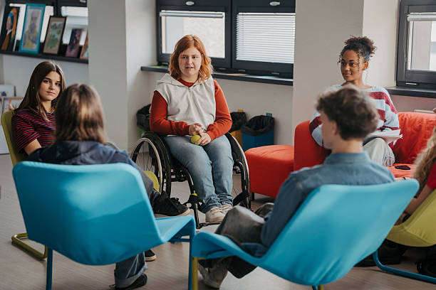istock Teen students talking together in inclusive school setting. 2248095707