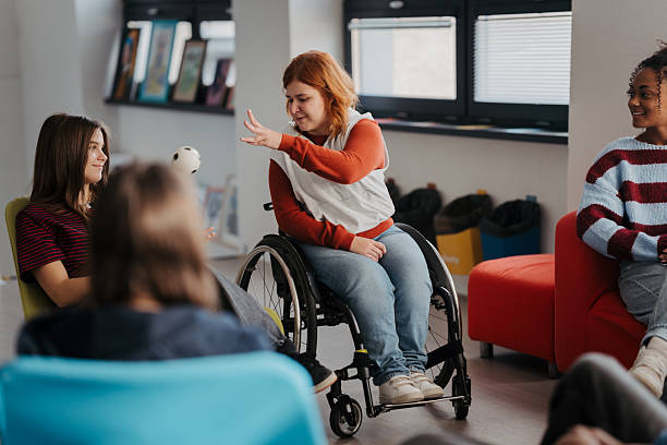 istock Teen students talking together in inclusive school setting. 2248095938