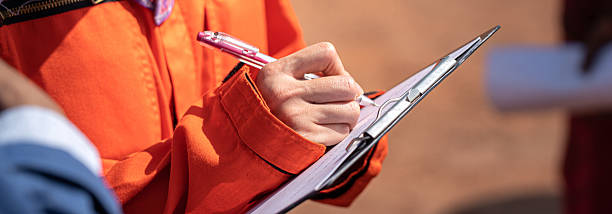istock Action of an engineer is writing maintenance service detail. 2248095963