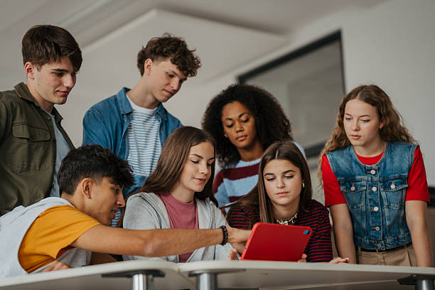 istock Teen students learning together with digital tablet in modern classroom. 2248096134