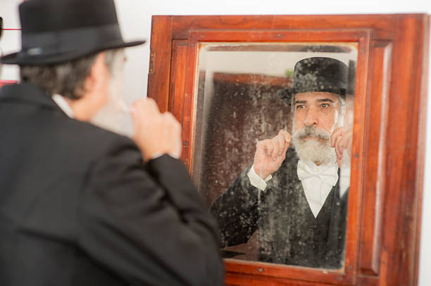 The scene suggests preparation, ritual vanity, or perhaps an attempt to preserve a traditional self-image. The antique, stained mirror reinforces the idea of ​​memory, the past, or an identity constructed over the years. The meticulous gesture with his mustache evokes the pride and masculine elegance of a historical era marked by formality.