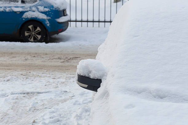 istock Snowfall. Cars in the snow during a snowfall. 2248098004