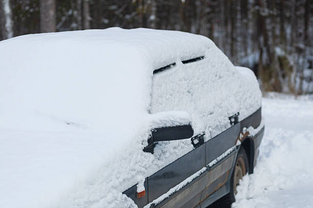 istock Snowfall. Cars in the snow during a snowfall. 2248098009