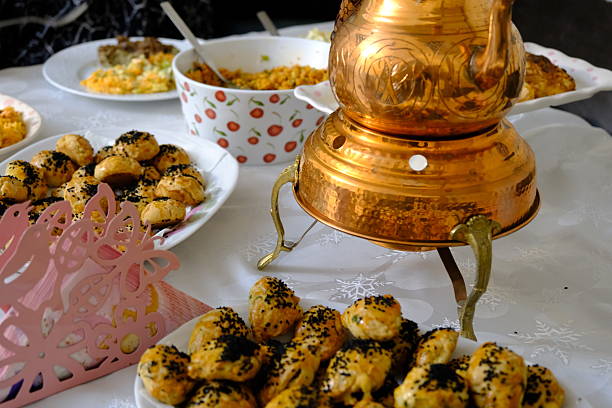Woman serving traditional Turkish raw meatballs on plate for Iftar dinner. Turkish oriental dishes.