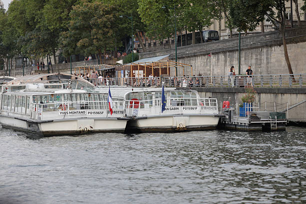 Paris, France - June 9, 2023: Passenger boats on the Seine river.