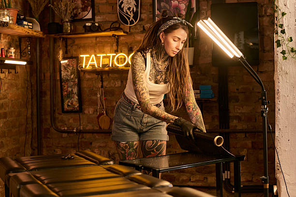 istock Young Woman Preparing Tattoo Station in Modern Studio 2248101437