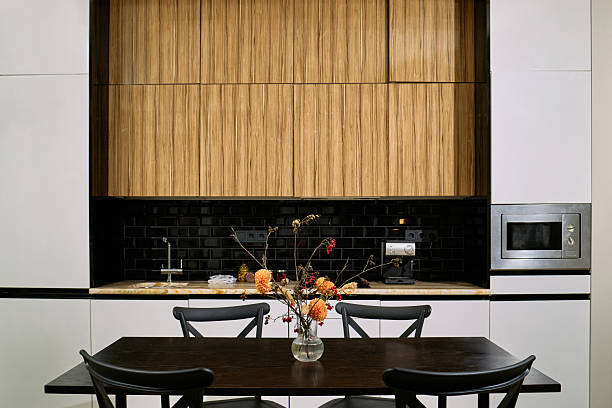 istock Modern Kitchen Interior Featuring Wooden Cabinets and Black Tile Backsplash 2248102389