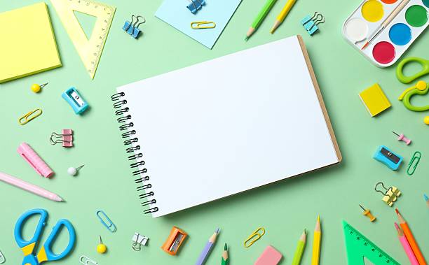 istock Open notebook with school stationery on green background, top view 2248102517