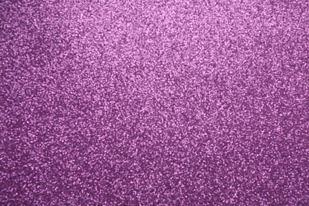 A fluid color gradient blends deep purple and plum into a silky abstract background, where defocused, blurred circle lights glow above a field of fine glitter. The wide central copy space works as an instant template for upscale marketing, limited-time sale headers, or VIP party invites. Its refined texture and quiet glamour evoke warm romance and high-end beauty, suiting winter-through-spring holiday promotions from christmas luxury drops to valentine campaigns.