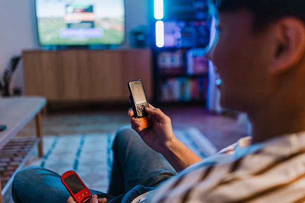 istock A teenager using retro mobile phone at home 2248103196