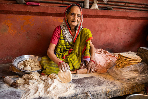 istock Elderly Woman Making Flatbreads in Jaipur, India 2248103544