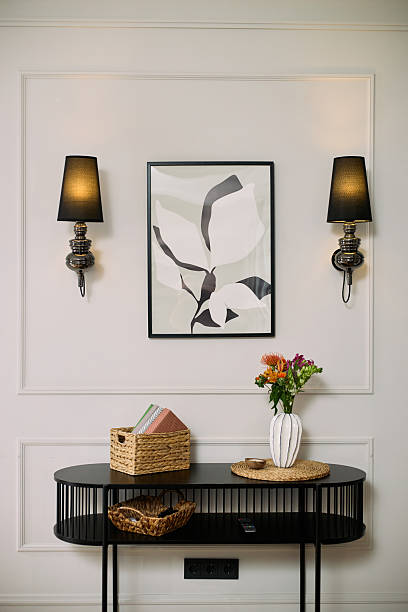 istock Modern Console Table Displaying Flower Vase and Decorative Basket in Hallway 2248103985