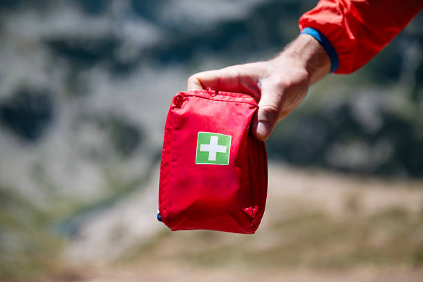 istock Man holding first aid kit in the mountain 2248104872