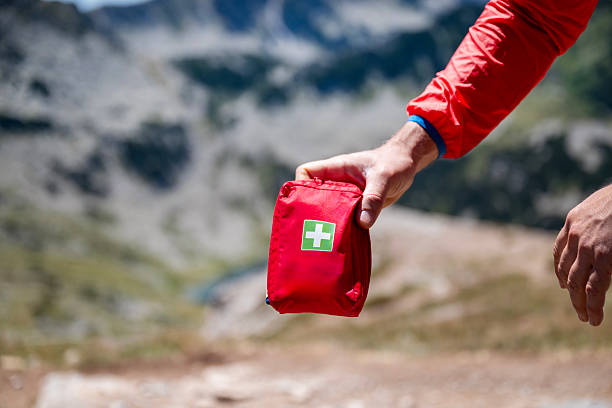 istock Man holding first aid kit in the mountain 2248104875