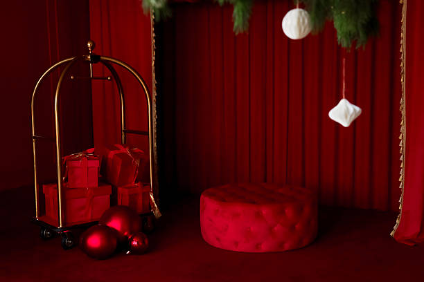 istock Festive red backdrop with gift display and holiday decorations for a joyful celebration 2248106452