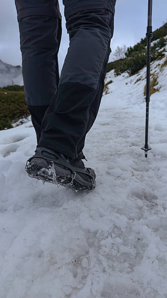 istock Snowshoes on winter boots in winter on snow on a clear day 2248106936