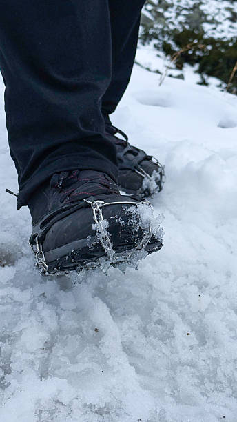 istock Snowshoes on winter boots in winter on snow on a clear day 2248106938