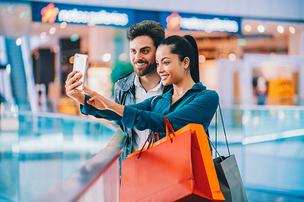 istock Couple taking selfie in the shopping mall 2248109100
