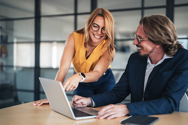 istock Business colleagues communicating and collaborating in an office 2248109274
