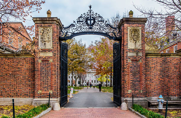 Cambridge, Massachusetts, USA - November 21, 2025: The Johnston Gate is one of the several entrances to Harvard University's Harvard Yard in Cambridge, Massachusetts. Completed in 1889, it opens onto Peabody Street (often mistaken for Massachusetts Avenue, from which Peabody Street diverges nearby) just north of Harvard Square. It was the gift of Samuel Johnston, Harvard College class of 1855.