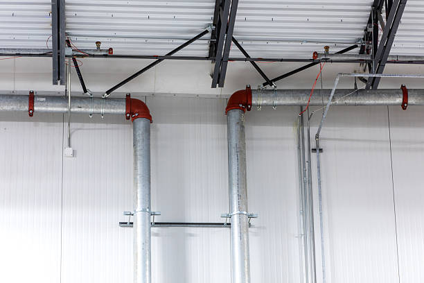 istock industrial pipes and valves in warehouse wall and ceiling 2248111217