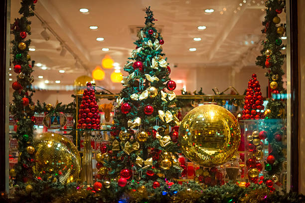 Festive Christmas Tree and Decorations in a Shop Window