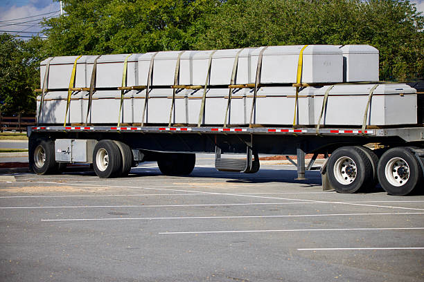 istock Twenty-two burial vaults loaded and secured on a trailer for transport 2248114687