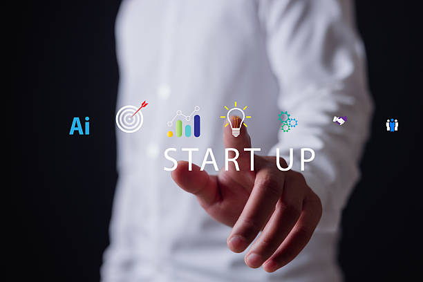 istock Businessman holding digital tablet with startup icons including AI, target, analytics, innovation, and teamwork, representing technology, entrepreneurship business growth. 2248123576