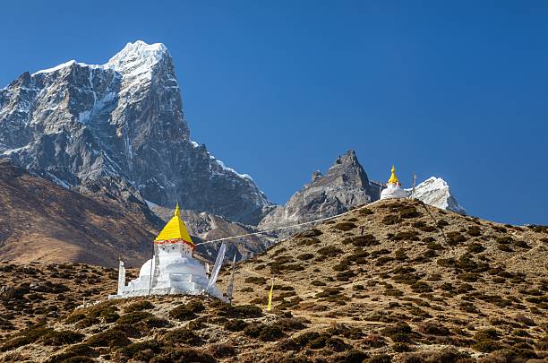 istock buddhist stupa with prayer flags near dingboche village 2248124863