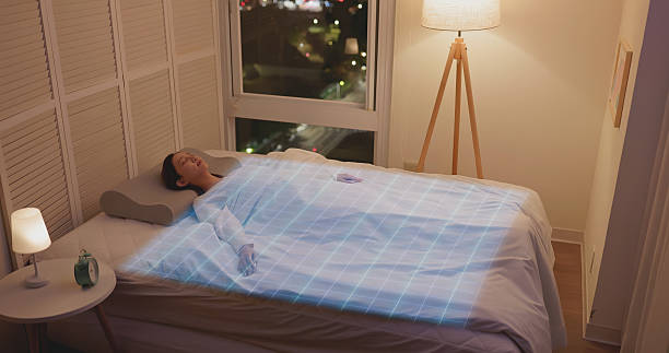 istock Woman sleeping with smart bed monitoring system 2248126644