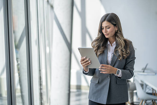 istock Businesswoman using digital tablet in modern office 2248127612