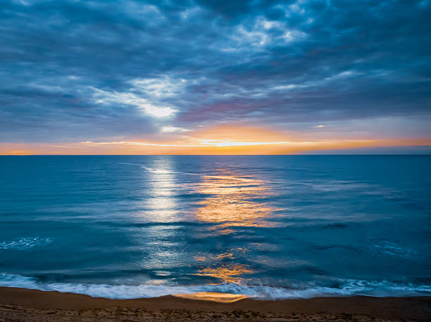 istock Sunrise at the Seaside with rain clouds 2248136284