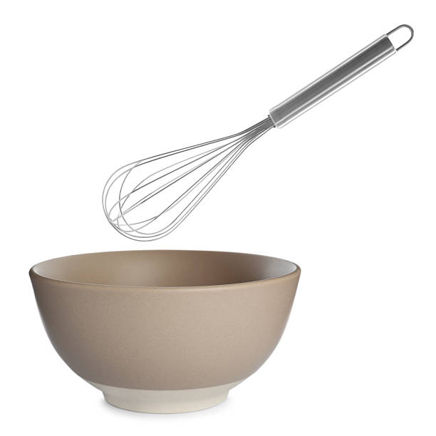 istock Metal whisk and ceramic bowl isolated on white. Cooking utensils 2248136559