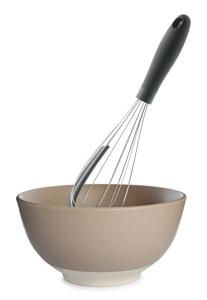 istock Metal whisk and ceramic bowl isolated on white. Cooking utensils 2248136565